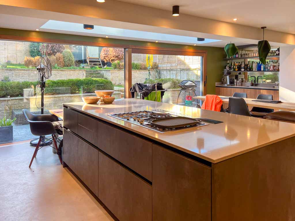 Contemporary bedroom with a double bed, bedside tables, and built-in wardrobes. Soft lighting and neutral decor create a peaceful and restful mood.